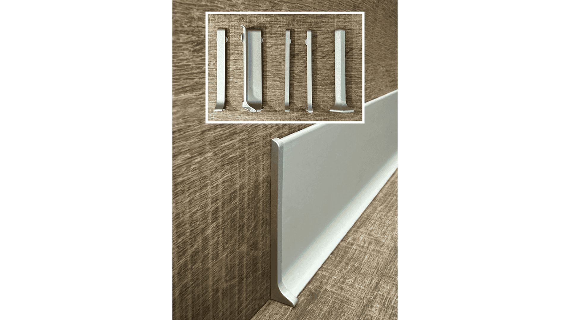 Close-up of a white baseboard installed along a brown textured wall. An inset shows five types of molding or baseboard profile samples displayed vertically against the same brown background.