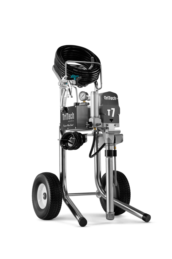 A TriTech T7 airless paint sprayer on large wheels with hoses and controls visible, standing upright against a plain background.