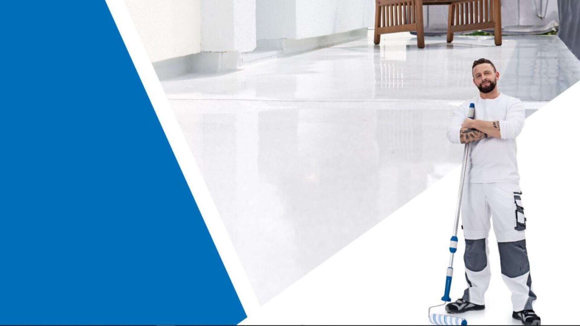 A man in work clothes stands with a mop on a shiny, clean white floor. Furniture and walls are visible in the background. A large blue geometric shape appears on the left side of the image.