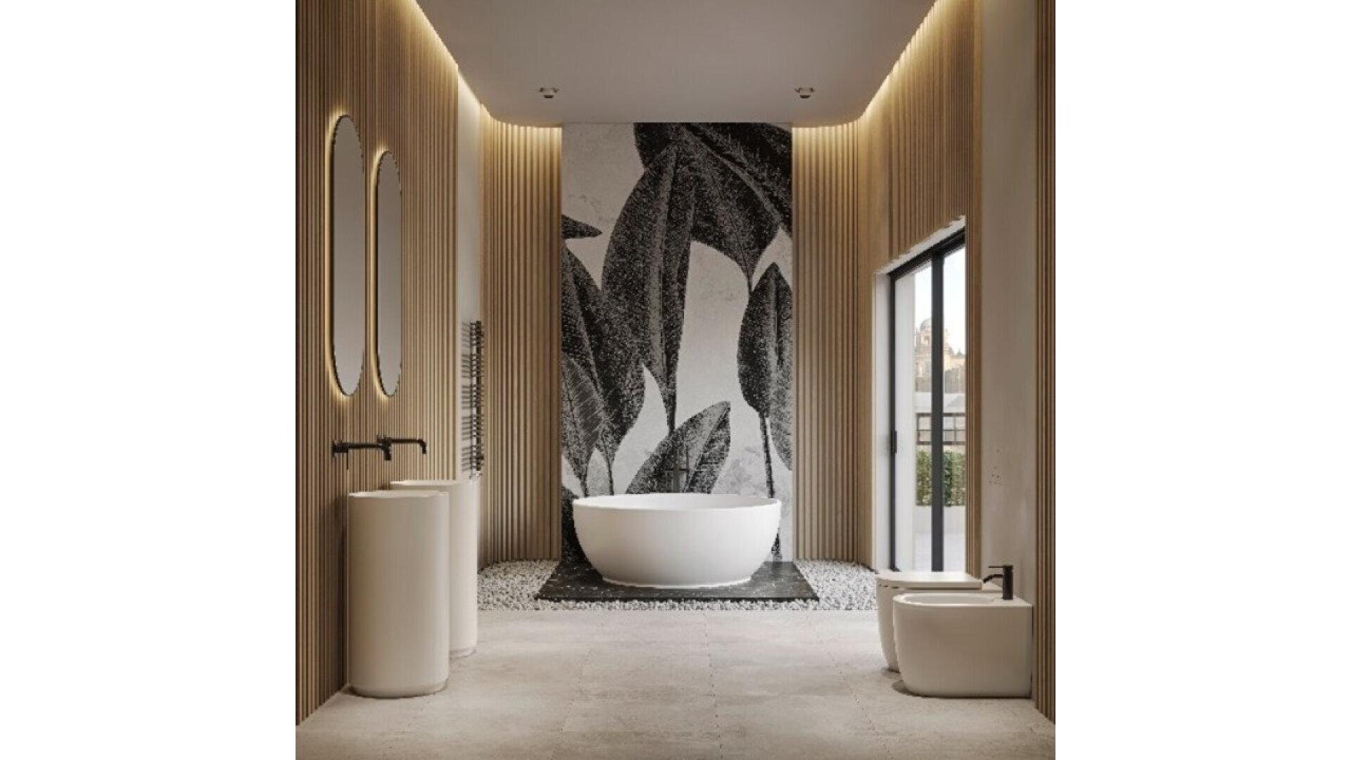 Modern bathroom with a freestanding tub, large black and white leaf mural, tall mirrors, pedestal sinks, wood slat walls, and a large window letting in natural light.