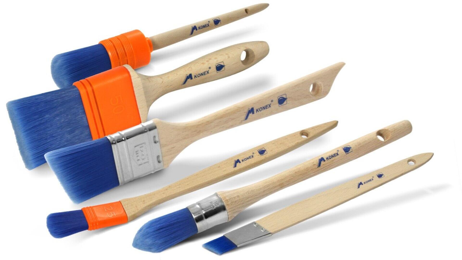 A set of five paintbrushes with wooden handles and blue bristles in various sizes and shapes, arranged diagonally on a white background.