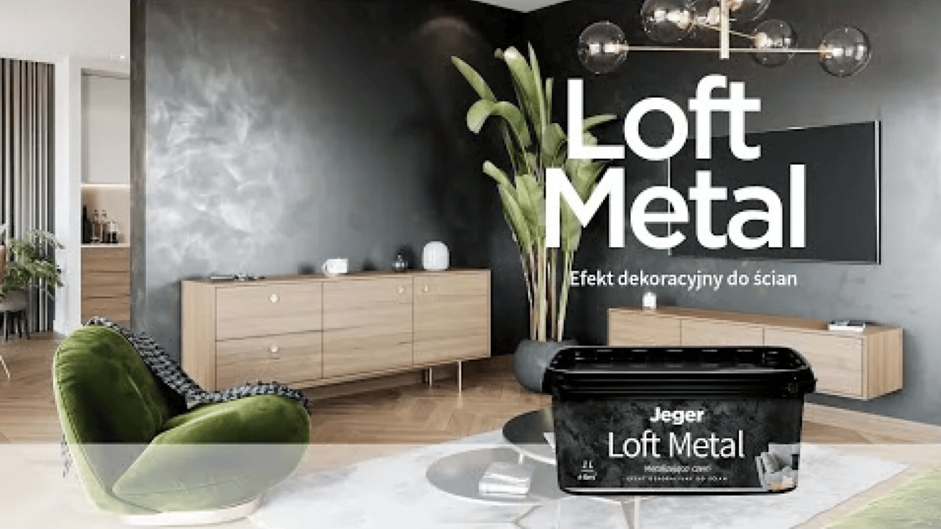 Ein modernes Wohnzimmer mit einer schwarzen Metall-Akzentwand, stilvollen Möbeln und einem grünen Samtsessel. Im Vordergrund steht ein Behälter mit der Aufschrift „Jeger Loft Metal“. In großen Buchstaben steht: „Loft Metal – dekorative Effekte für den Raum“.