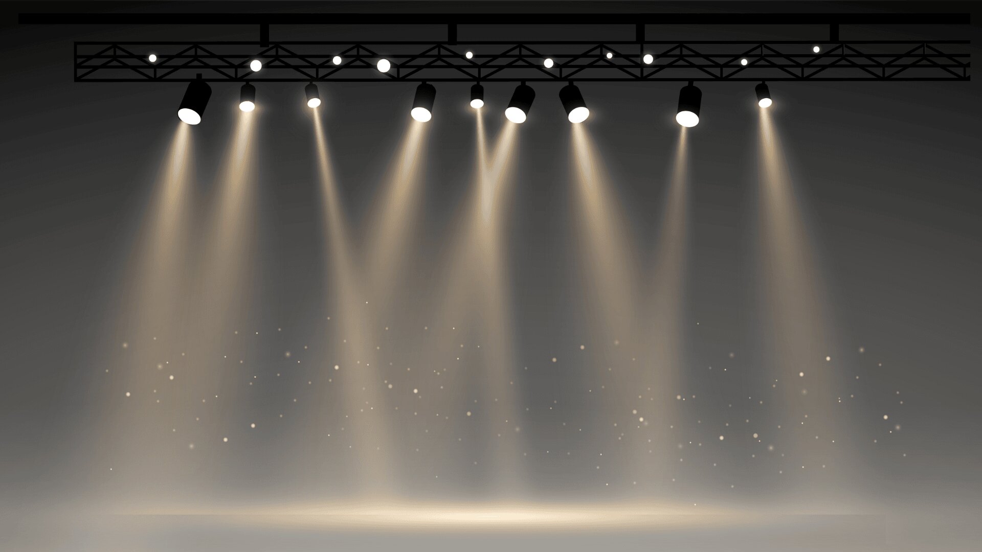 Eine Reihe von Bühnenscheinwerfern wirft helle Lichtstrahlen auf eine leere Bühne und erzeugt so eine dramatische und theatralische Atmosphäre mit im beleuchteten Raum schwebenden Partikeln.